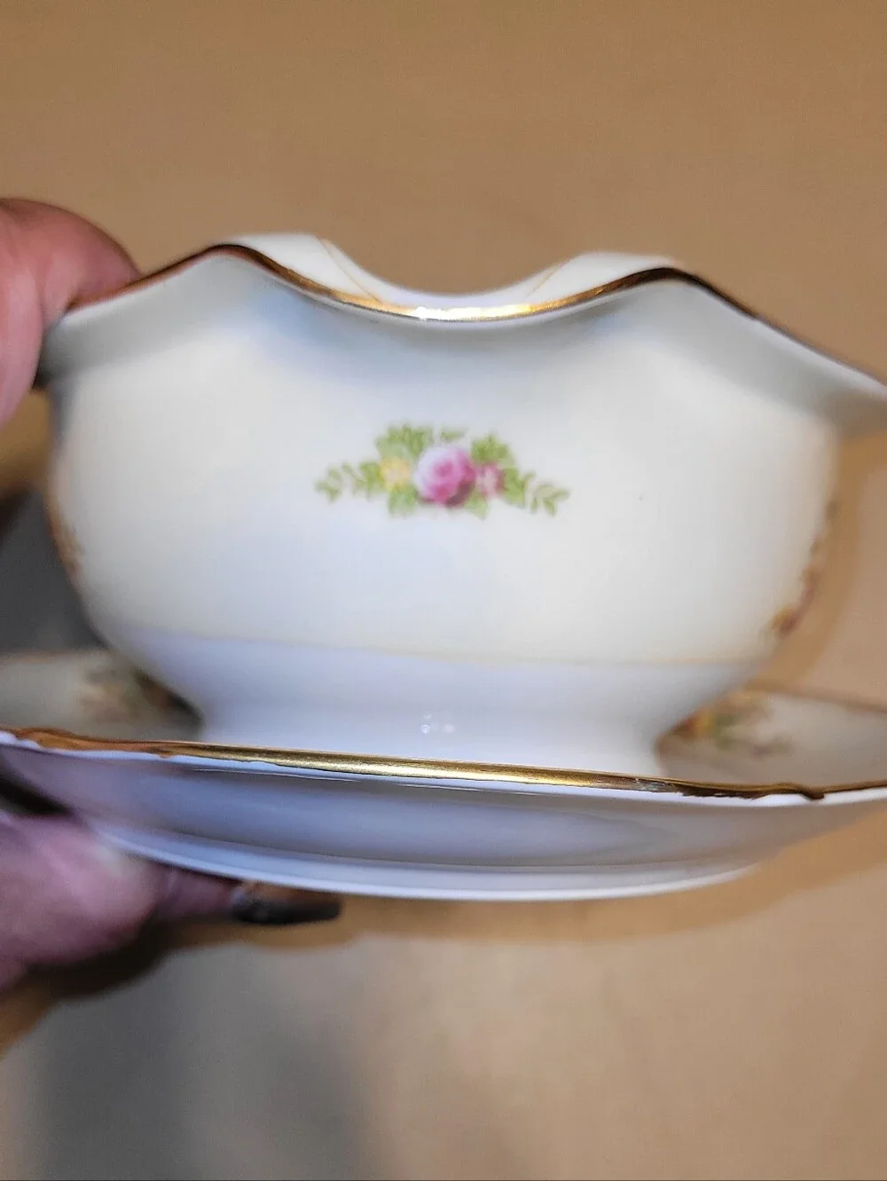 Meito China Hand Painted Porcelain Floral Gravy Boat with Attached Saucer.
